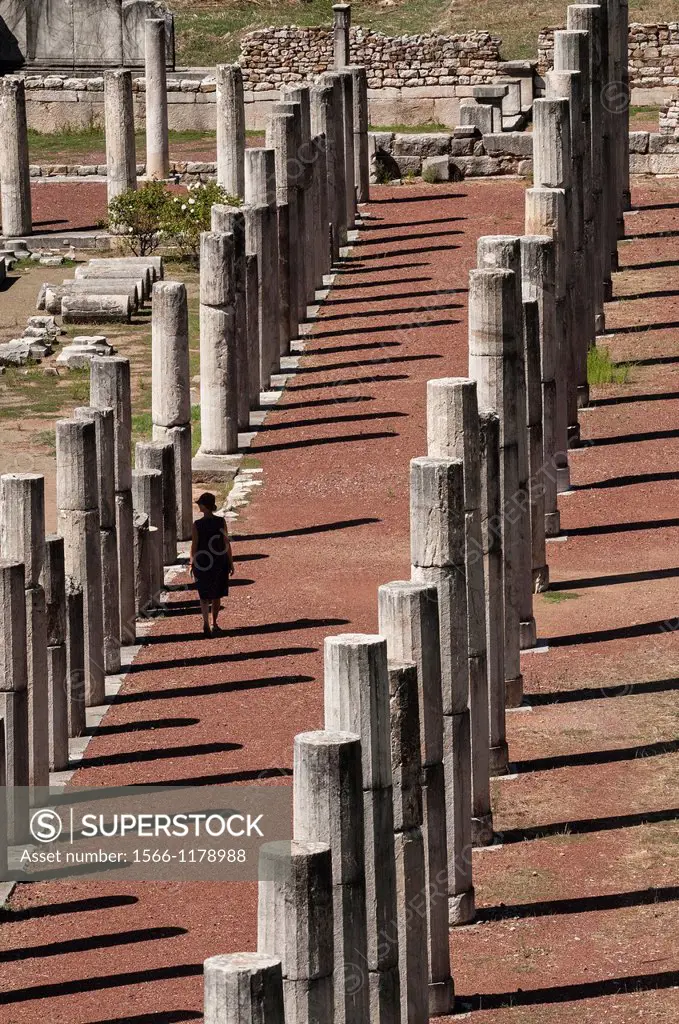 Walking amongst the doric stoas that surround the stadium, at Ancient Messene, Messinia, Peloponnese, Greece