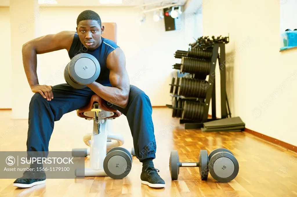 Tilburg, Netherlands  Young African-American man working out in the gym