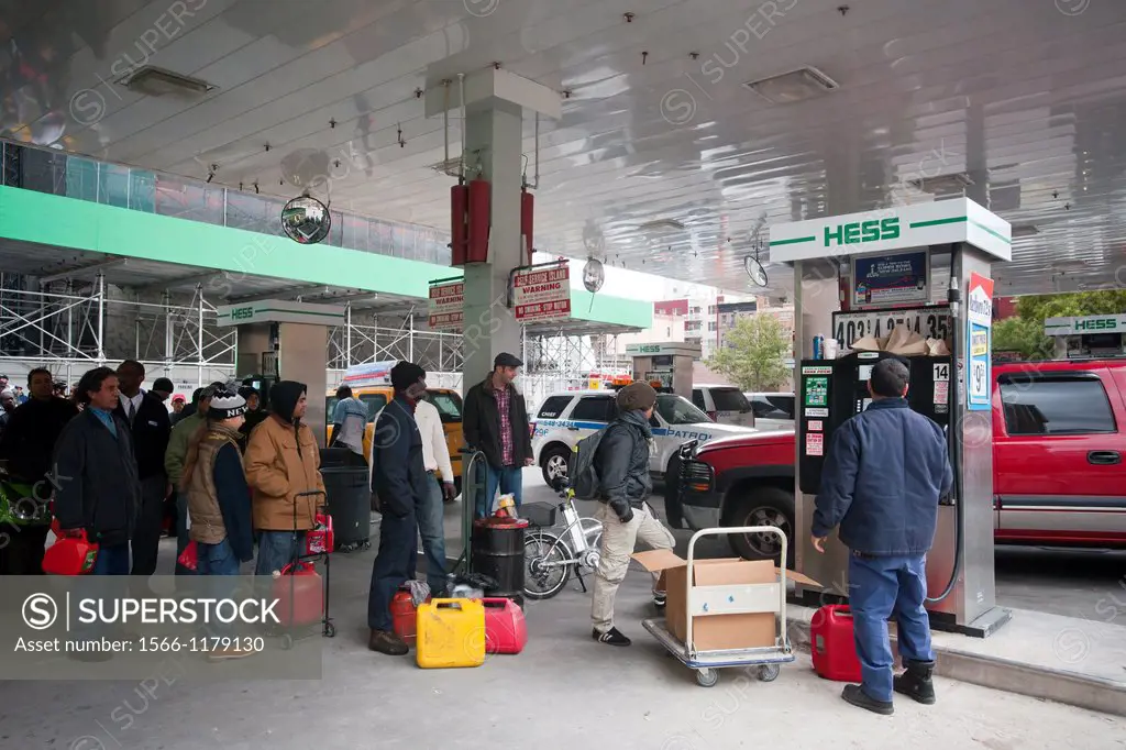 People line up to buy gasoline at a Hess gas station in the Clinton neighborhood of Manhattan in New York Motorists and people with gas cans waited as...