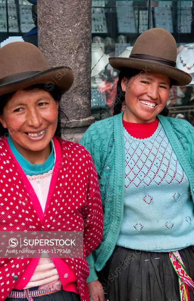 Traditional women in dress and hat in small town of Pisaq Peru