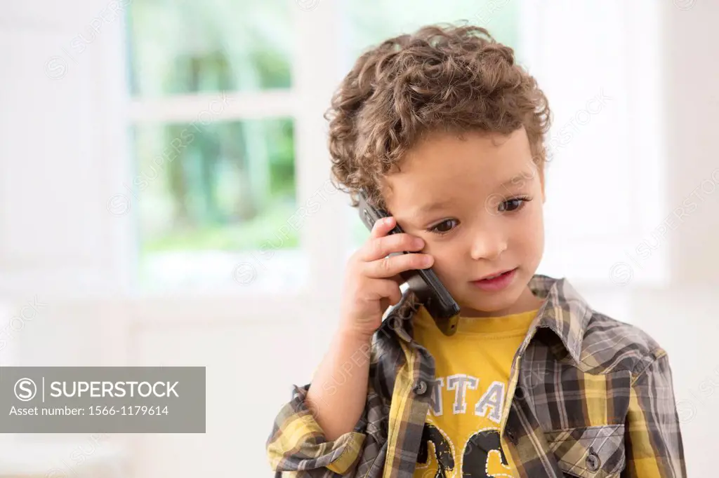 Four year old boy with cell phone