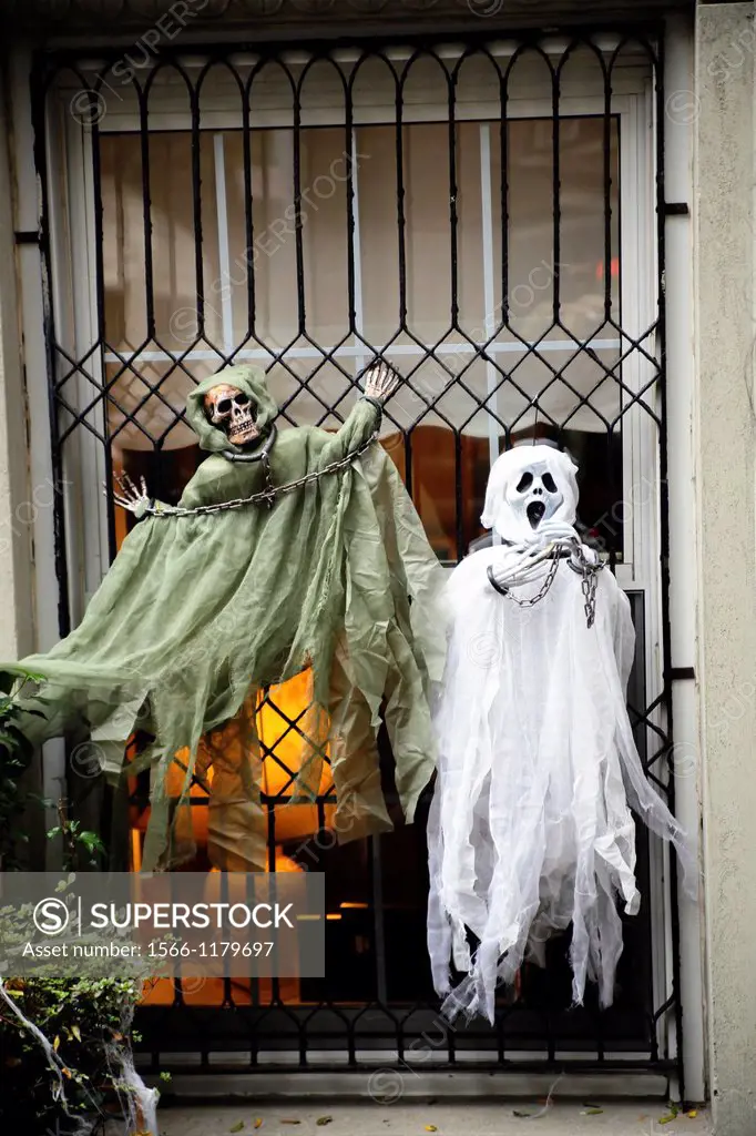 Halloween Ghost Dolls Decorating a Window of a New York City Town House