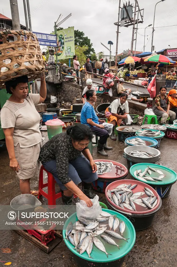 Woman selling fish, at the Pasar Badung market in Denpasar, Bali, Indonesia