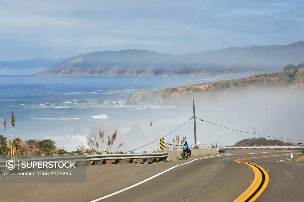 cyclist on Highway 1 Shoreline Highway between Westport and Fort Bragg, California, USA