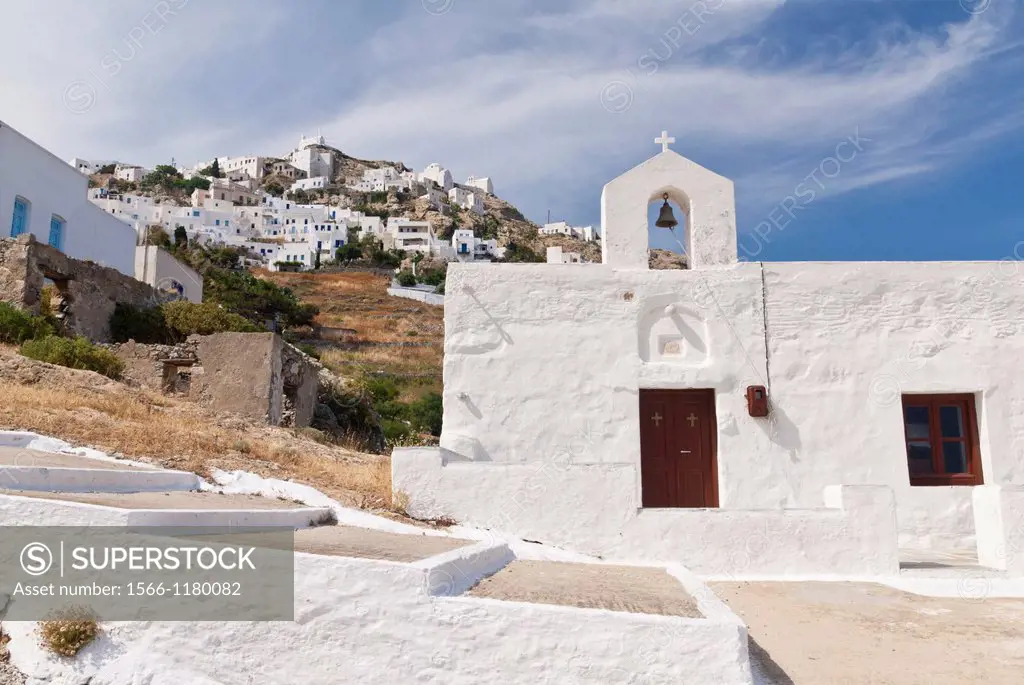 Views of Serifos´s Chora behind a whitewashed church, Serifos Island, Cyclades, Greece