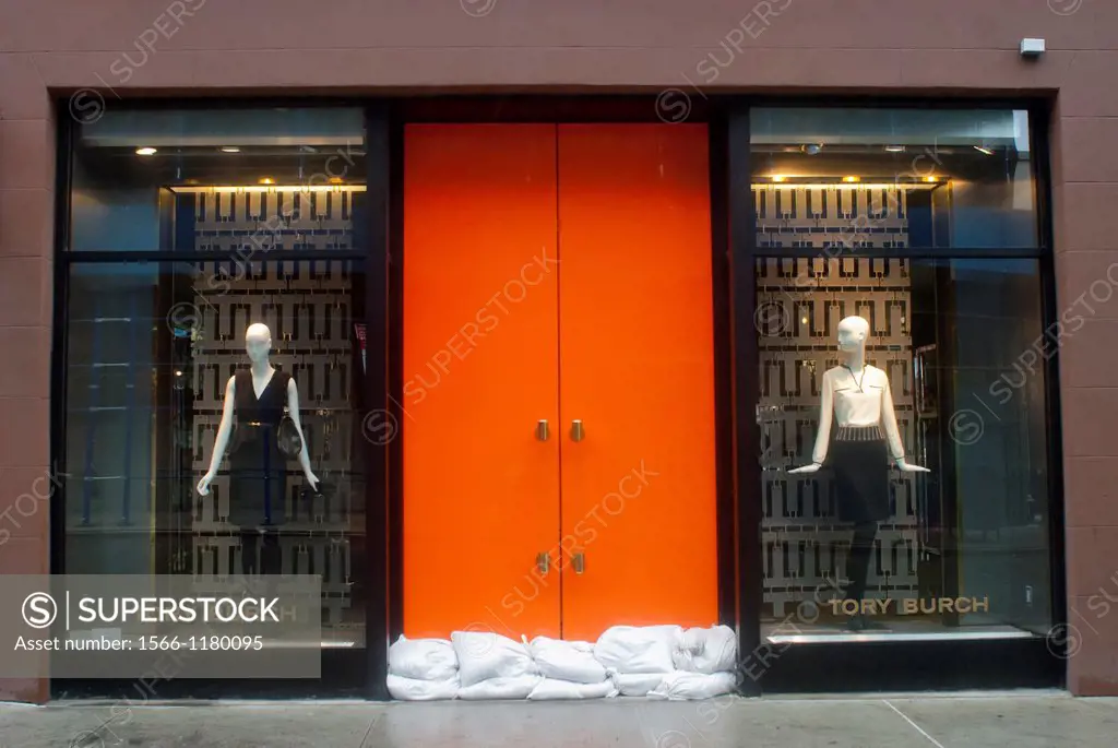 Sandbags are used to protect the entrance to the designer Tory Burch store in the Meatpacking District in New York Hurricane Sandy continues its stead...