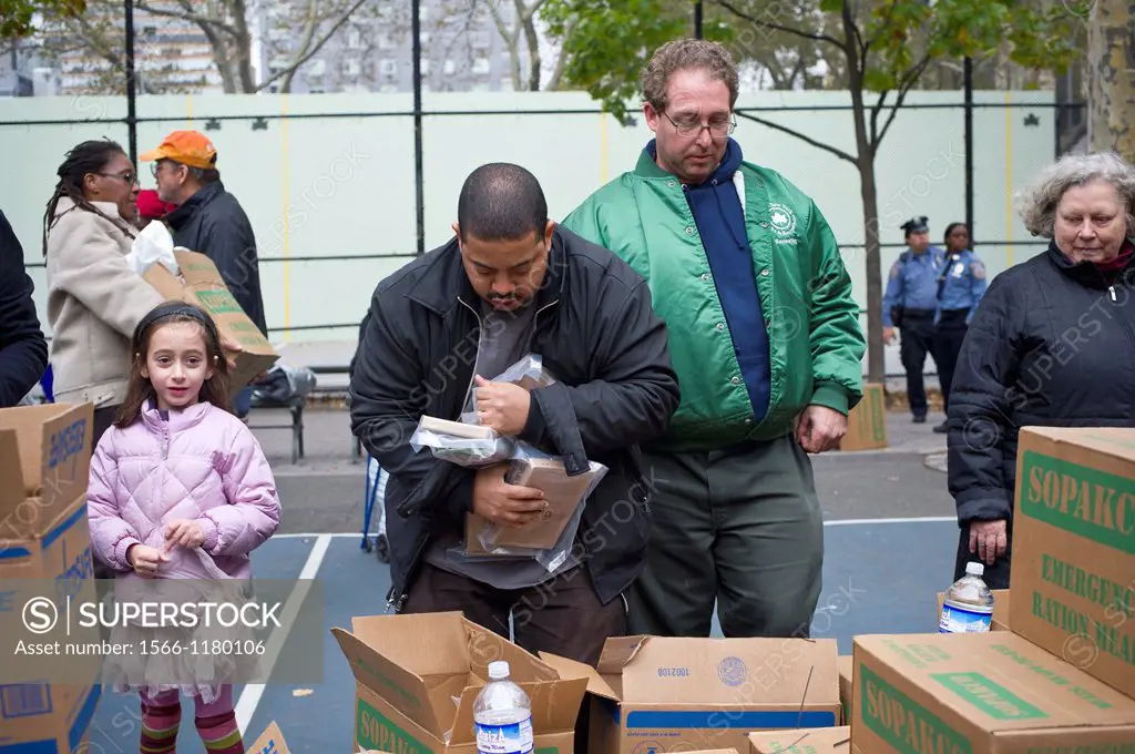 Ready to eat meals and bottled water are distributed to people in the Chelsea neighborhood in New York where there is no electric power due to Hurrica...