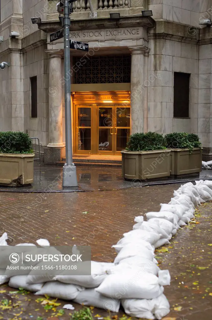 Sandbags are used to protect the entrance to the closed New York Stock Exchange in New York Hurricane Sandy continues its steady advance with heavy wi...