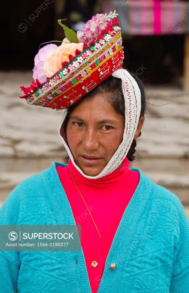 Portrait of young woman with traditional dress in small town of Pisaq Peru South America