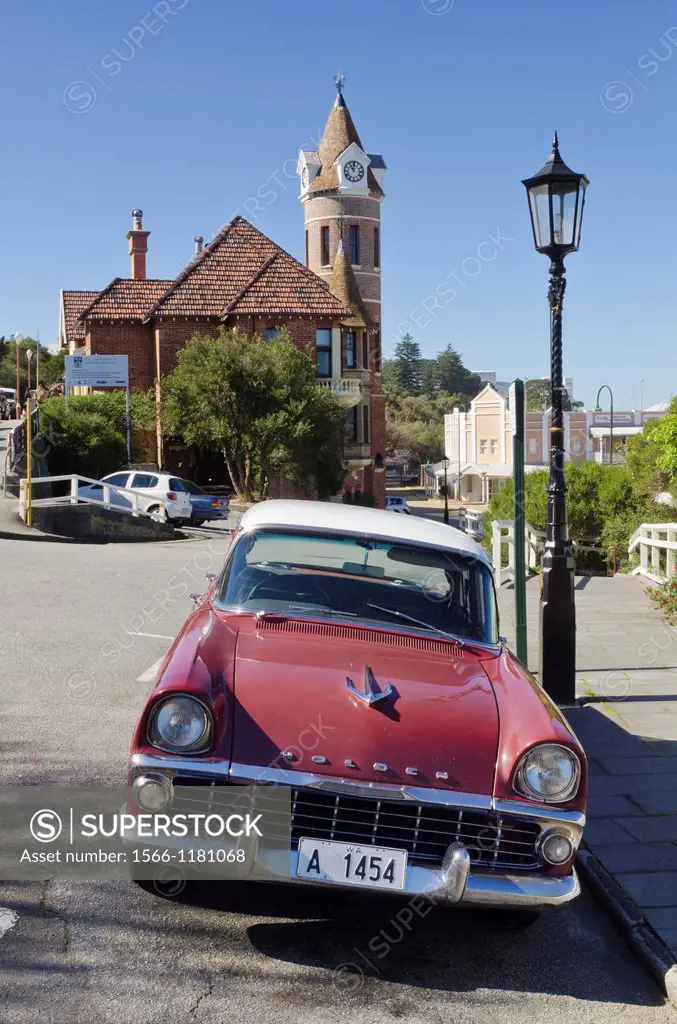 Old Holden EK Special car parked on Stirling Tce, with the clock tower of the old Post Office, Albany, Western Australia, Australia