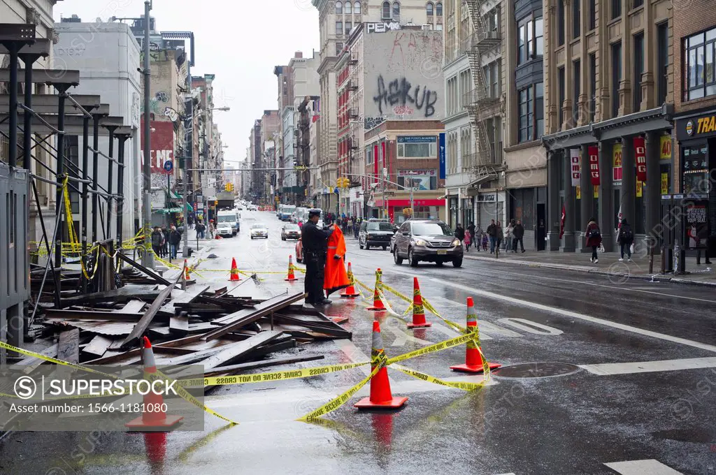 A NYPD officer guards a collapsed scaffold on Broadway in Lower Manhattan after Hurricane Sandy Hurricane Sandy roared into New York disrupting the tr...
