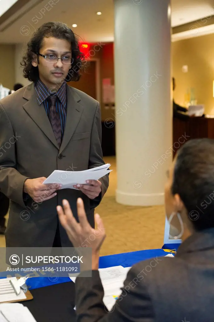 Job seekers attend a job fair at midtown in New York The US Labor Department reports new claims for unemployment benefits for last week were a seasona...