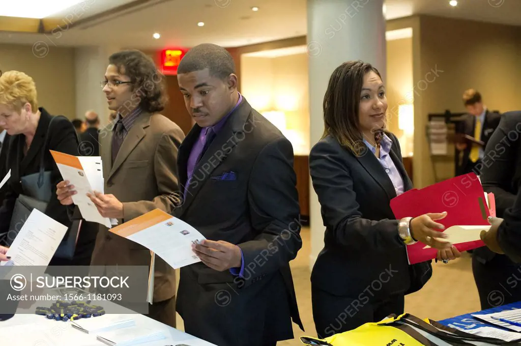 Job seekers attend a job fair at midtown in New York The US Labor Department reports new claims for unemployment benefits for last week were a seasona...