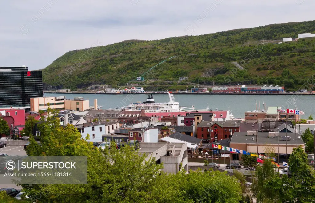 Newfoundland Canada St Johns capital harbor with ships in water and mountains