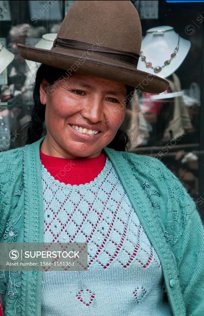 Traditional women in dress and hat in small town of Pisaq Peru