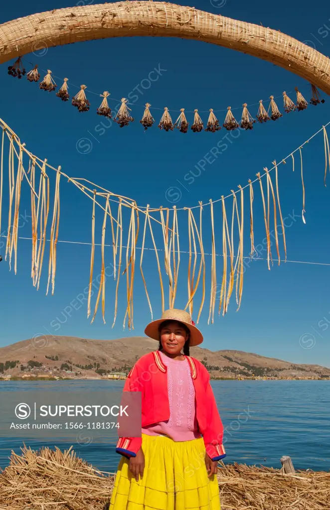 Lake Titicaca Peru with local traditional woman of Uros Tribe history in colorful clothes near Puno
