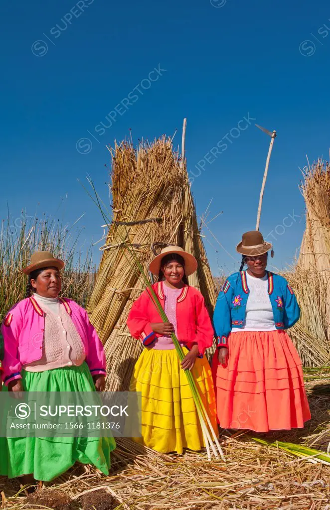 Lake Titicaca Peru with local traditional women of Uros Tribe history in colorful clothes near Puno