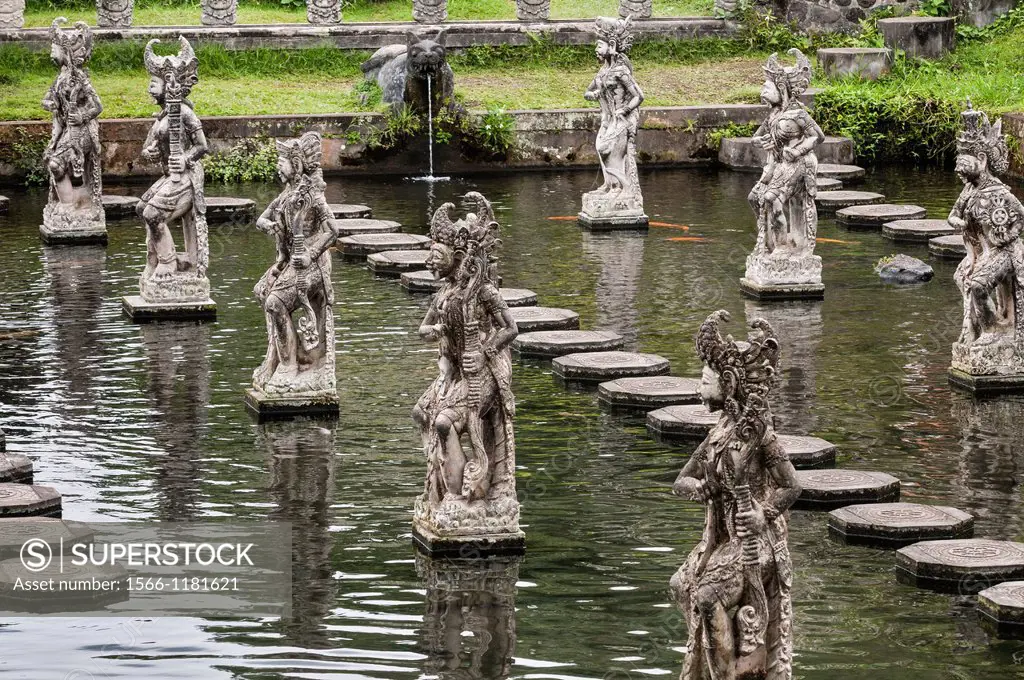 Stone statues and stepping stones at the Taman Tirtagangga water Palace and garden, Eastern Bali, Indonesia