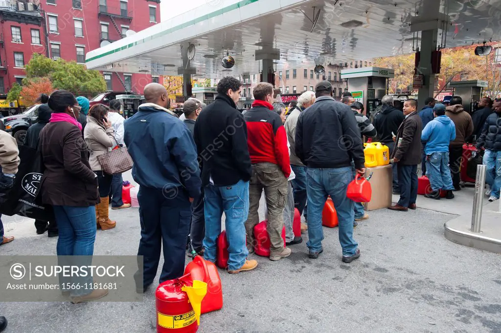 People line up to buy gasoline at a Hess gas station in the Clinton neighborhood of Manhattan in New York Motorists and people with gas cans waited as...