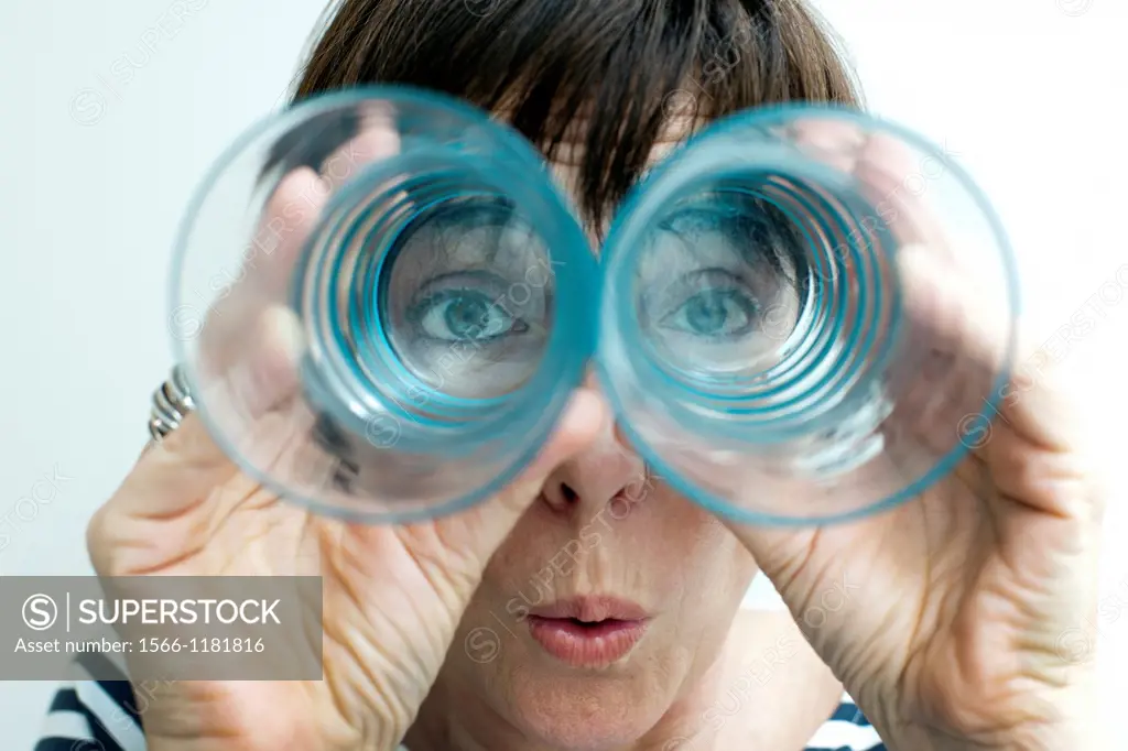 Close-up of woman looking through glasses