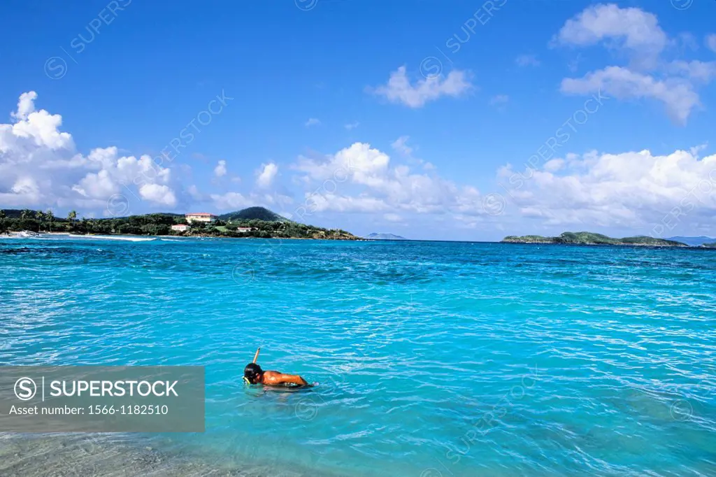 St Thomas beautiful beaches and blue water with snorkler at famous Sapphire Beach