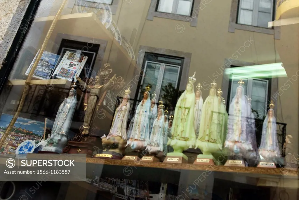 statuettes of Virgin Mary, Our Lady of Fatima, shop window in Alfama district, lisbon, portugal, europe