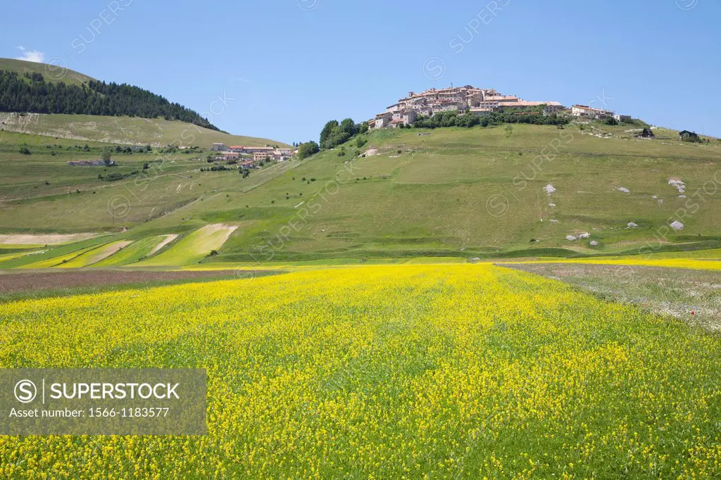 landscape wiyh the village of castelluccio di norcia, umbria, italy, europe