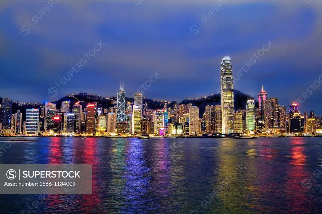 Beautiful new night photograph of the fabulous famous Hong Kong skyline with Victoris peak in background and all the tall skyscrapers lit at night