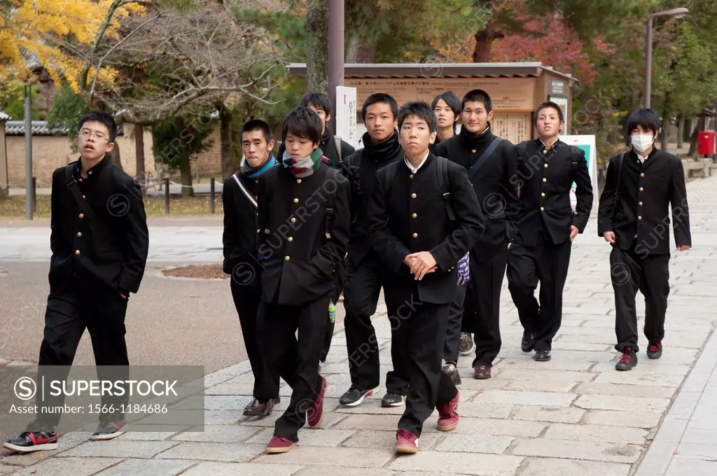 Japanese secondary students on a field trip  excursion  to the ancient capital of Nara  Wearing surgical face masks is a common practice in Japan