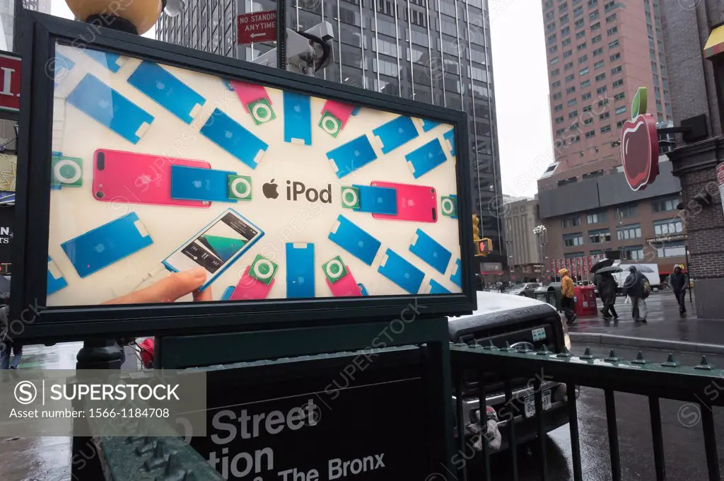 Advertising for the Apple´s line of iPods on a subway kiosk in New York