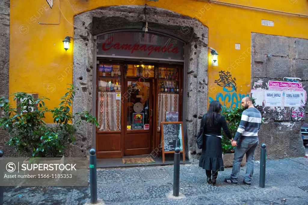 Couple outside Trattoria Campagnola restaurant Via dei Tribunali street centro storico Naples southern Italy Europe