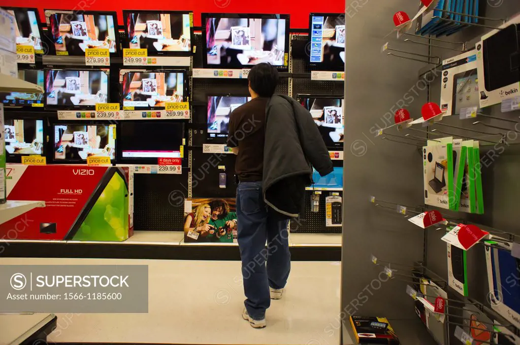 Shopper browses flat-screen televisions in a Target store in New York
