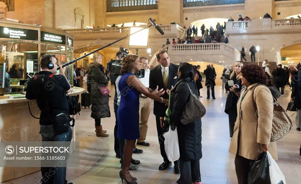 A news crew from WABC interviews commuters for a feature in Grand Central Terminal in New York