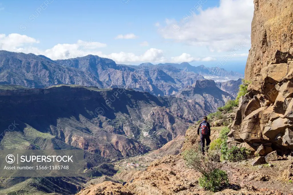 Female hiker near summit of Roque Bentayga near Tejeda on Gran Canaria, Canary Islands, Spain