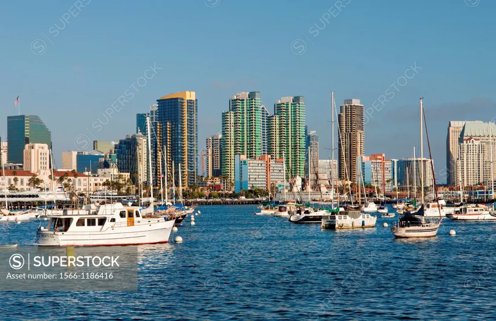 San Diego Bay in California with boats and ships in water and skyline of San Diego