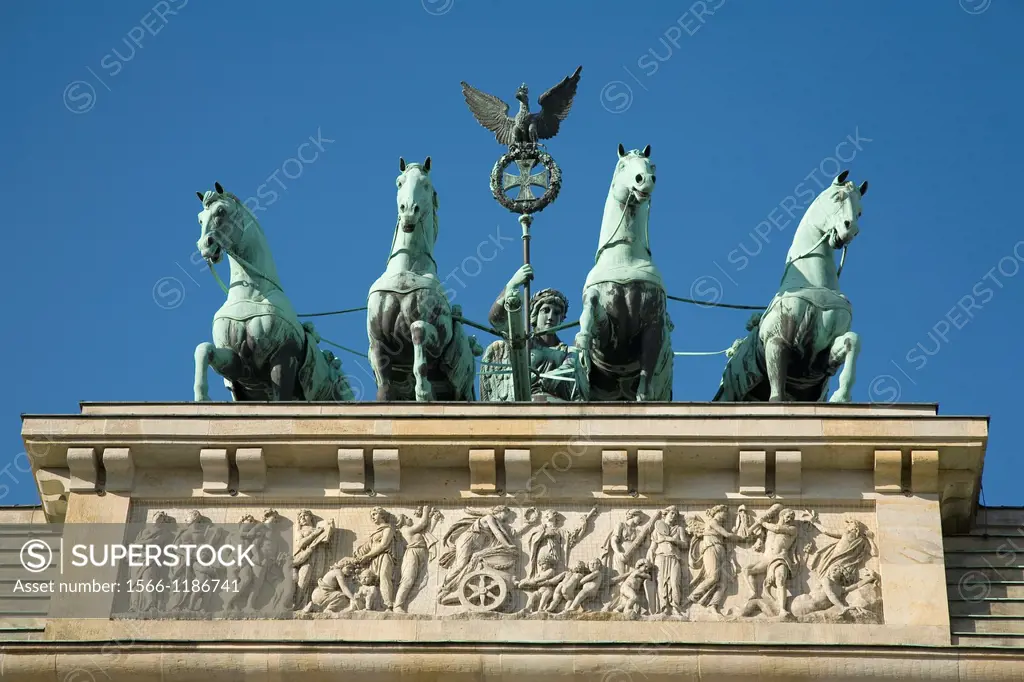 Brandenburg Gate is topped with a copper sculpture, the Quadriga, created by Johann Gottfried Schawdow  Berlin, Germany, Europe