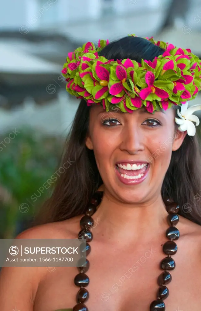 Hawaii, Oahu, Honolulu, Waikiki Beach, Hawaiian woman wearing headdress and beads