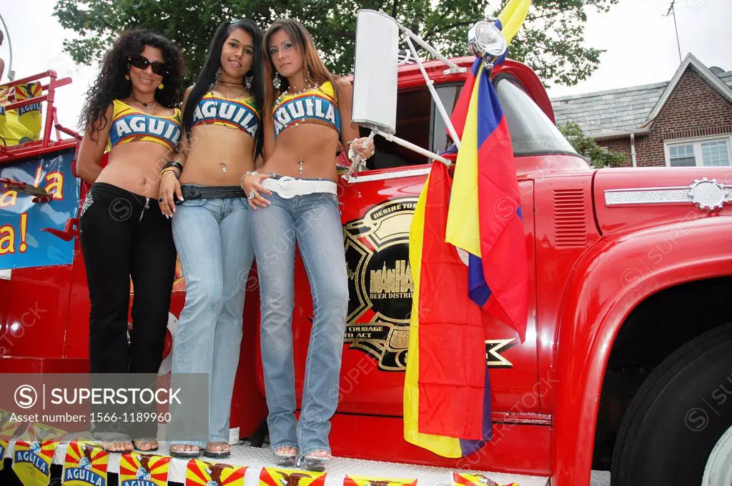 New York City, sexy women publicizing Aguila Colombian beer at the annual July Colombian Day Parade held in Jackson Heights, Queens