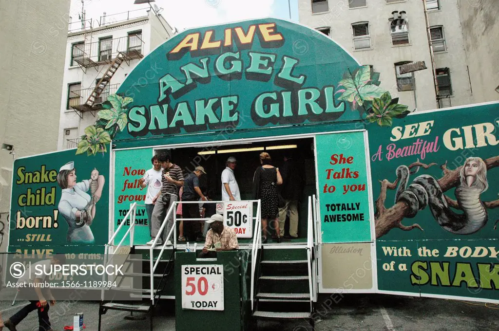 New York City, snake-girl’ show during San Gennaro’s feast, Little Italy, Manhattan