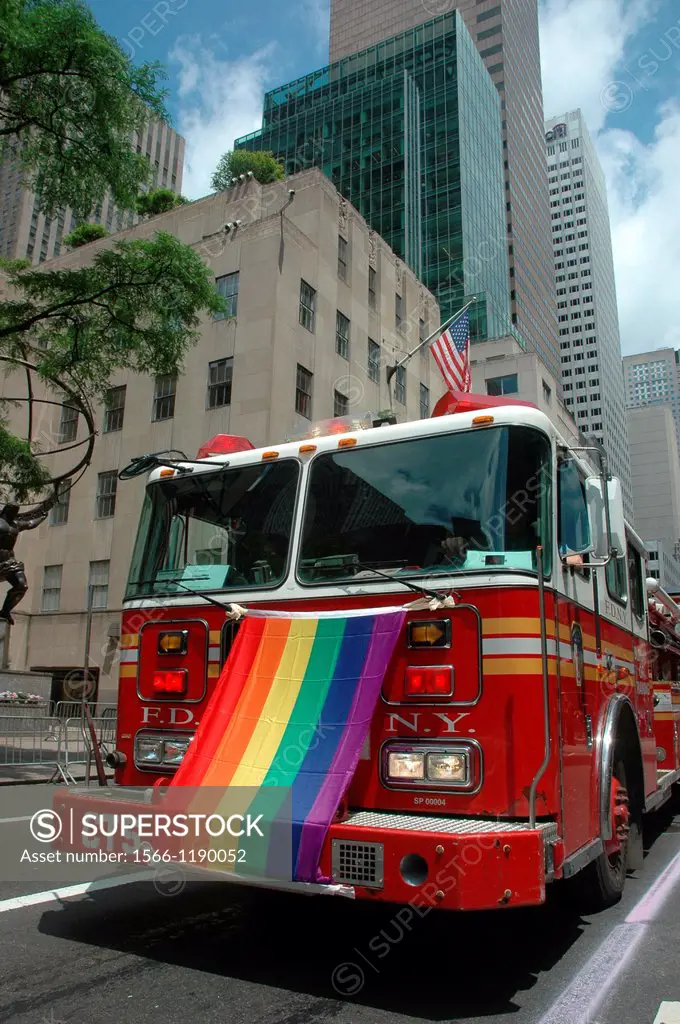 New York City, Manhattan, a firefighters truck with the LGBT flag at the Gay Pride March June