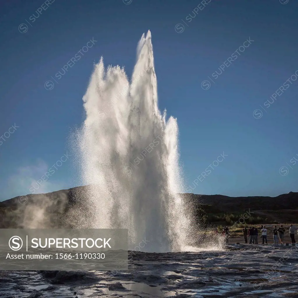 Strokkur geyser erupting, Iceland Strokkur is a fountain geyser in the geothermal area beside the Hvita River in the Haukadalur valley  It erupts abou...