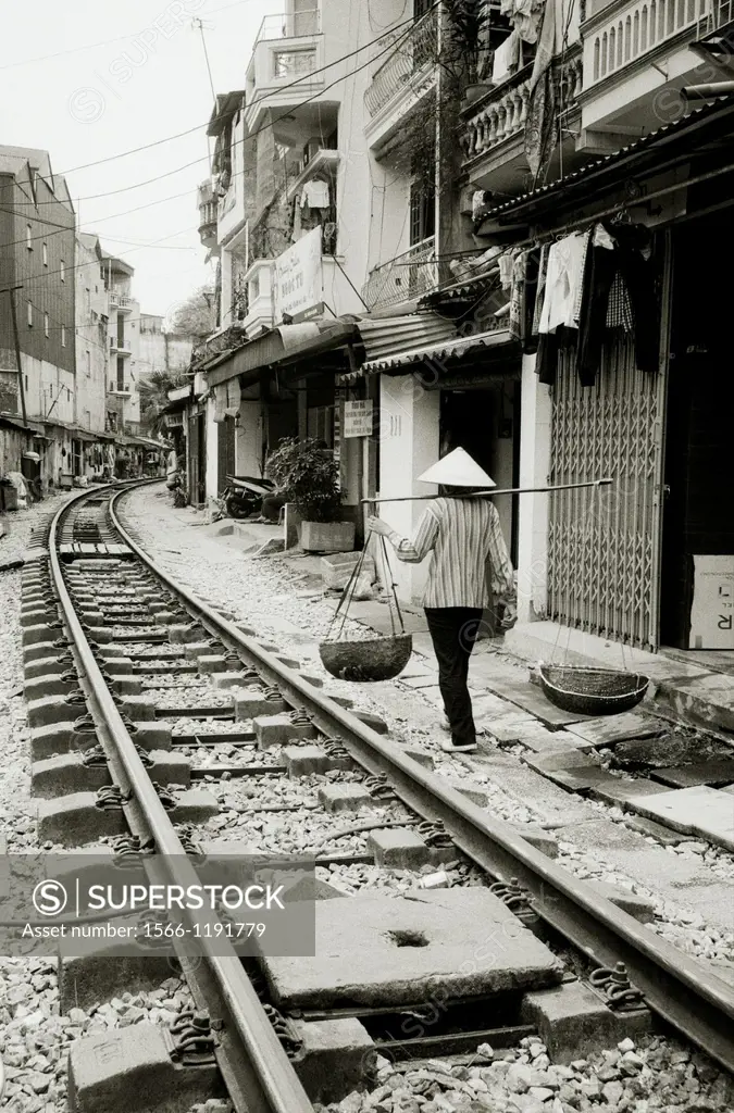 Daily life by the train tracks in Hanoi in Vietnam in Southeast Asia Far East 