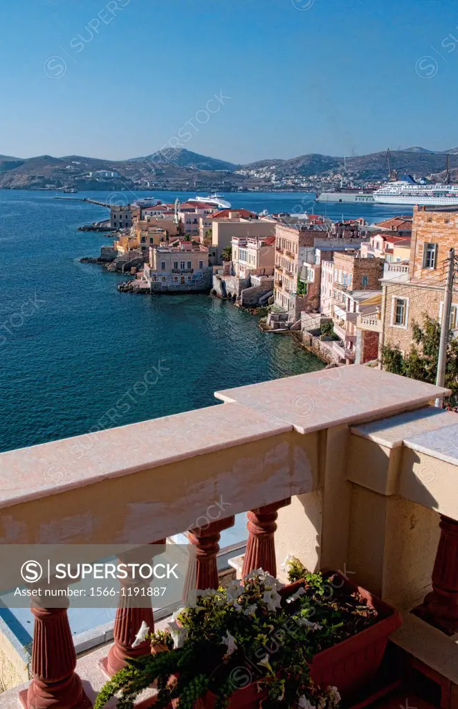 Syros Greece Islands in Hermoupolis capital with white buildings balcony over water ocean classic architecture