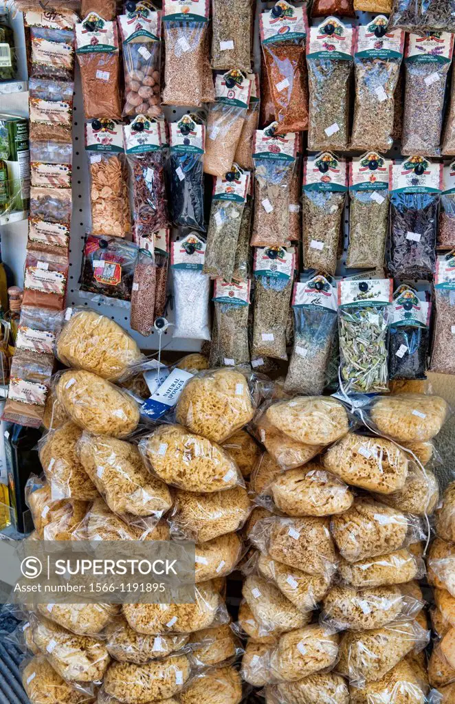 Display of Greek souvenirs sponges and spices on rack in downtown shopping area of Athens Greece in Plaka