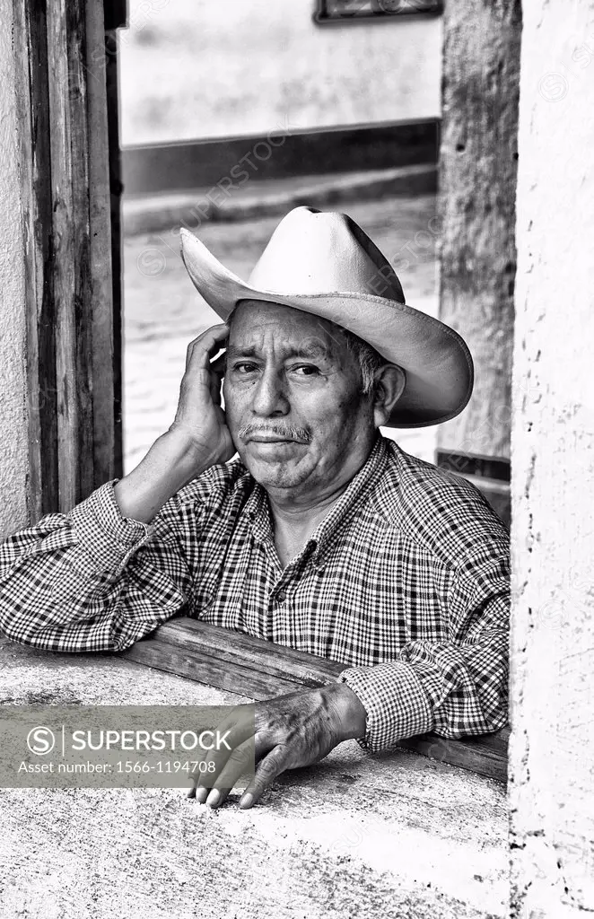 Local humble poor man portrait with cowboy hat in Lake Atitlan village of San Pedro Guatemala in Central America