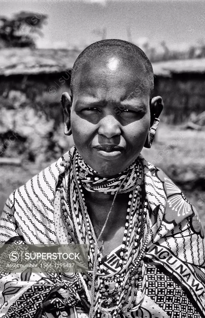 Maasai tribe dark woman in costume traditional dress in jungles near Kenya Africa