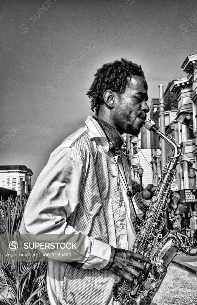 Black man playing sax in Gay Pride Weekend Pink Celebration in the gay Castro District of San Francisco California