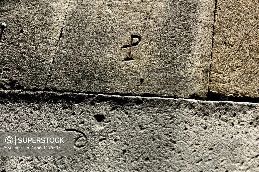Stone mason marks on a wall of Francisco de los Cobos y Molina house, Ubeda, Jaen province.