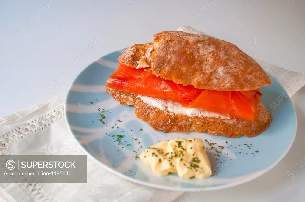 Spanish tapa: sandwich of smoked salmon and cheese cream