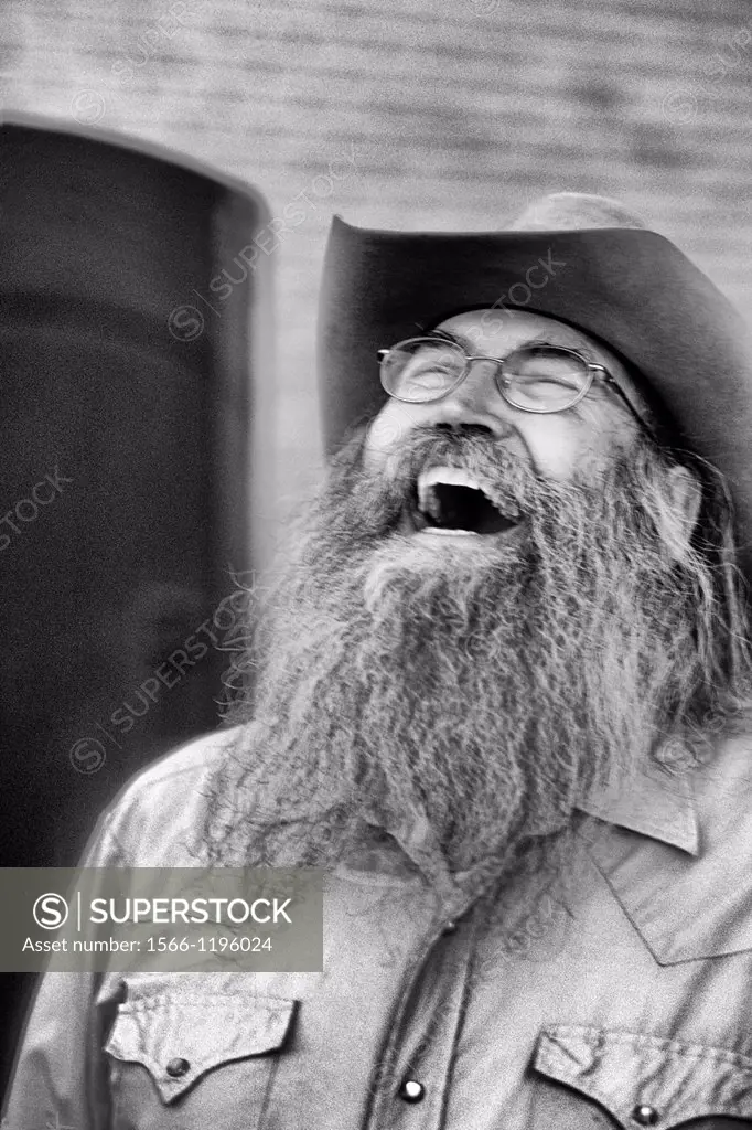 Abstract portrait of laughing cowboy with gray beard in Billings Montana